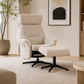 Beige upholstered recliner chair with  high back, padded armrests